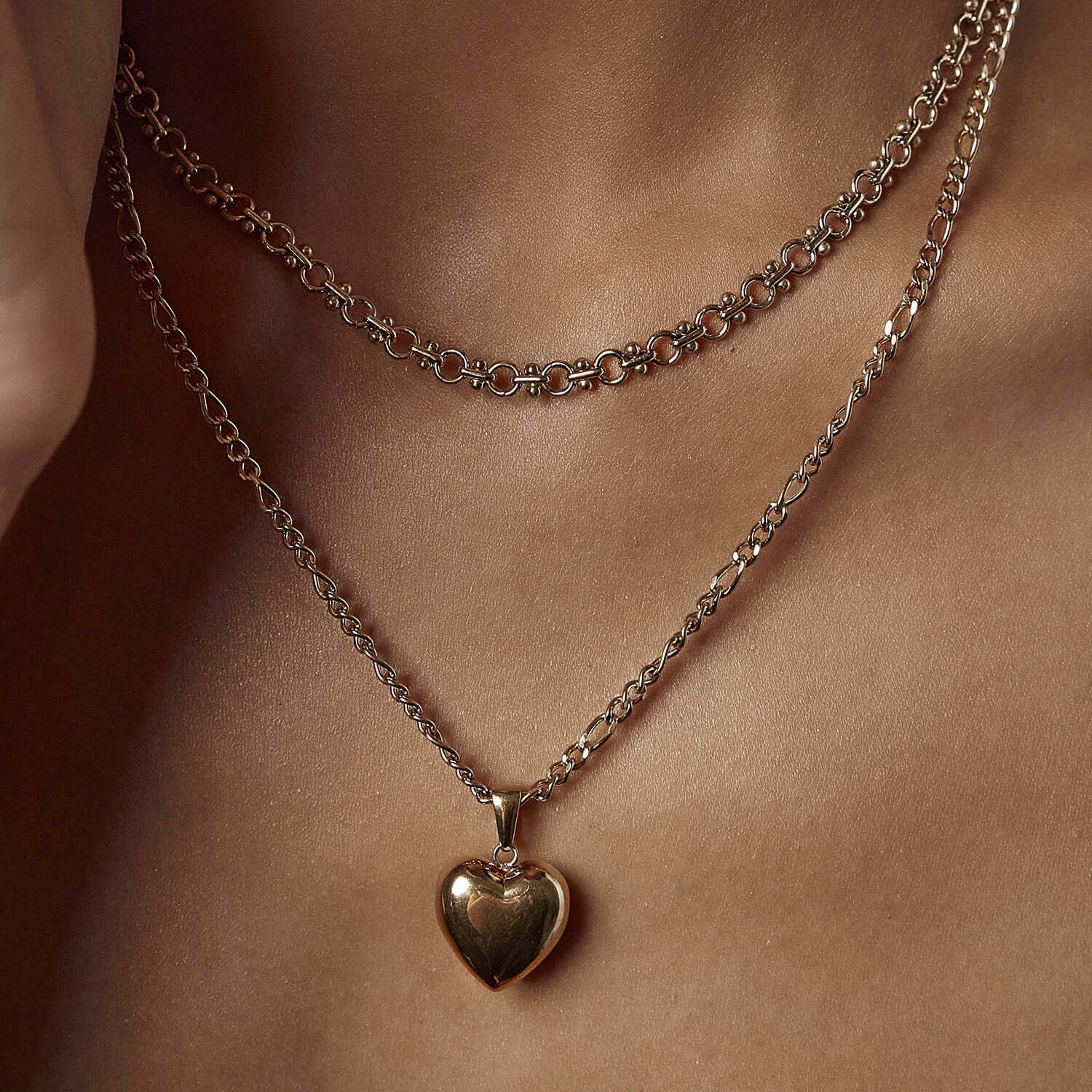 Gold chain necklace with heart pendant
