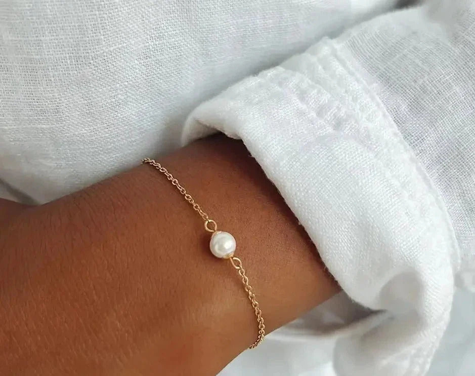 Model wearing pearl chain bracelet