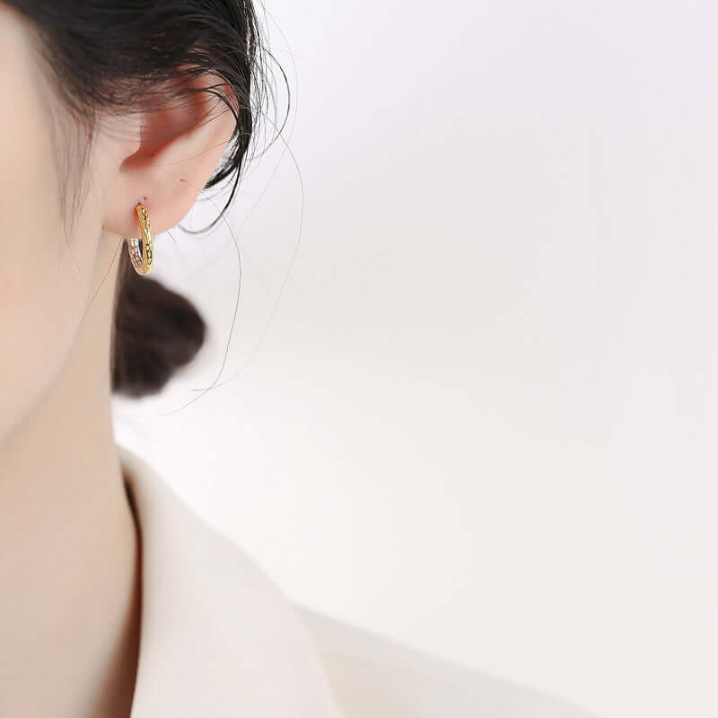 A woman showing her earring