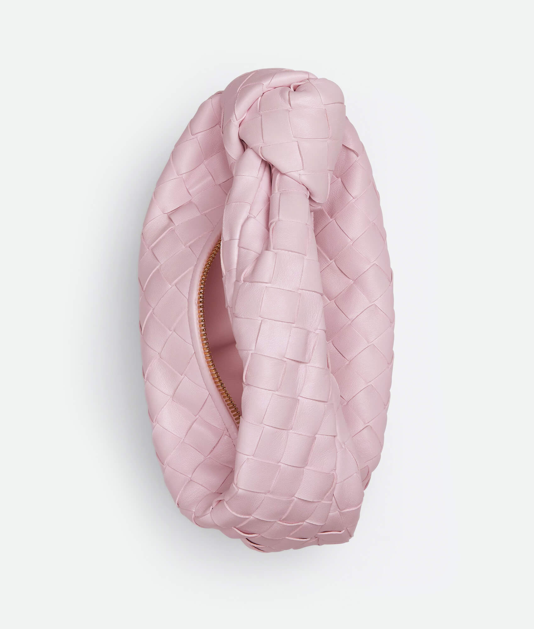 A pink woven handbag inspired by the Bottega Mini Jodie design, featuring a compact and rounded shape.