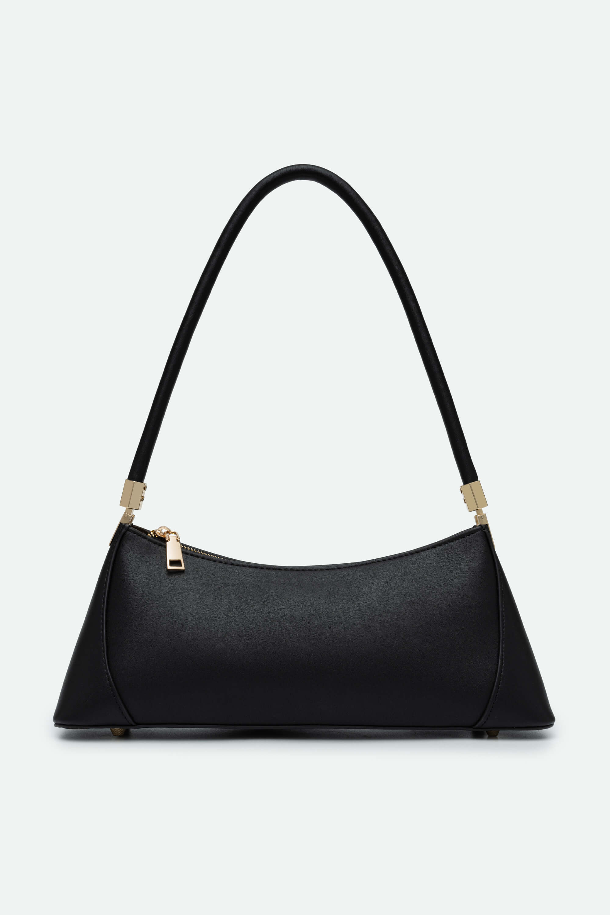 Black handbag with gold accents on a light gray background