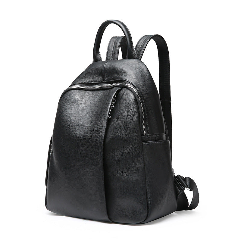 Black backpack with silver zips on white background