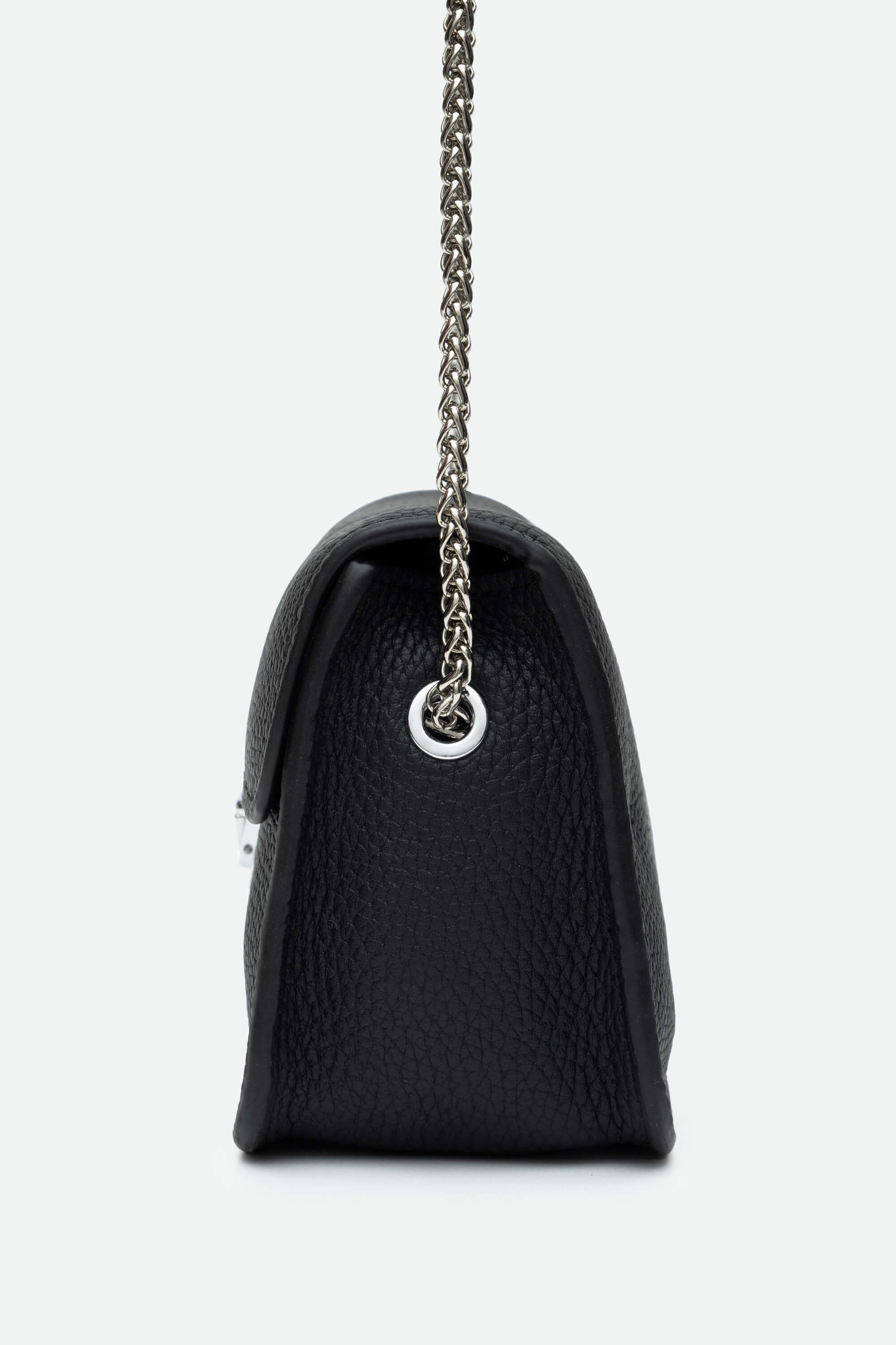 Black handbag with a chain strap on a light gray background