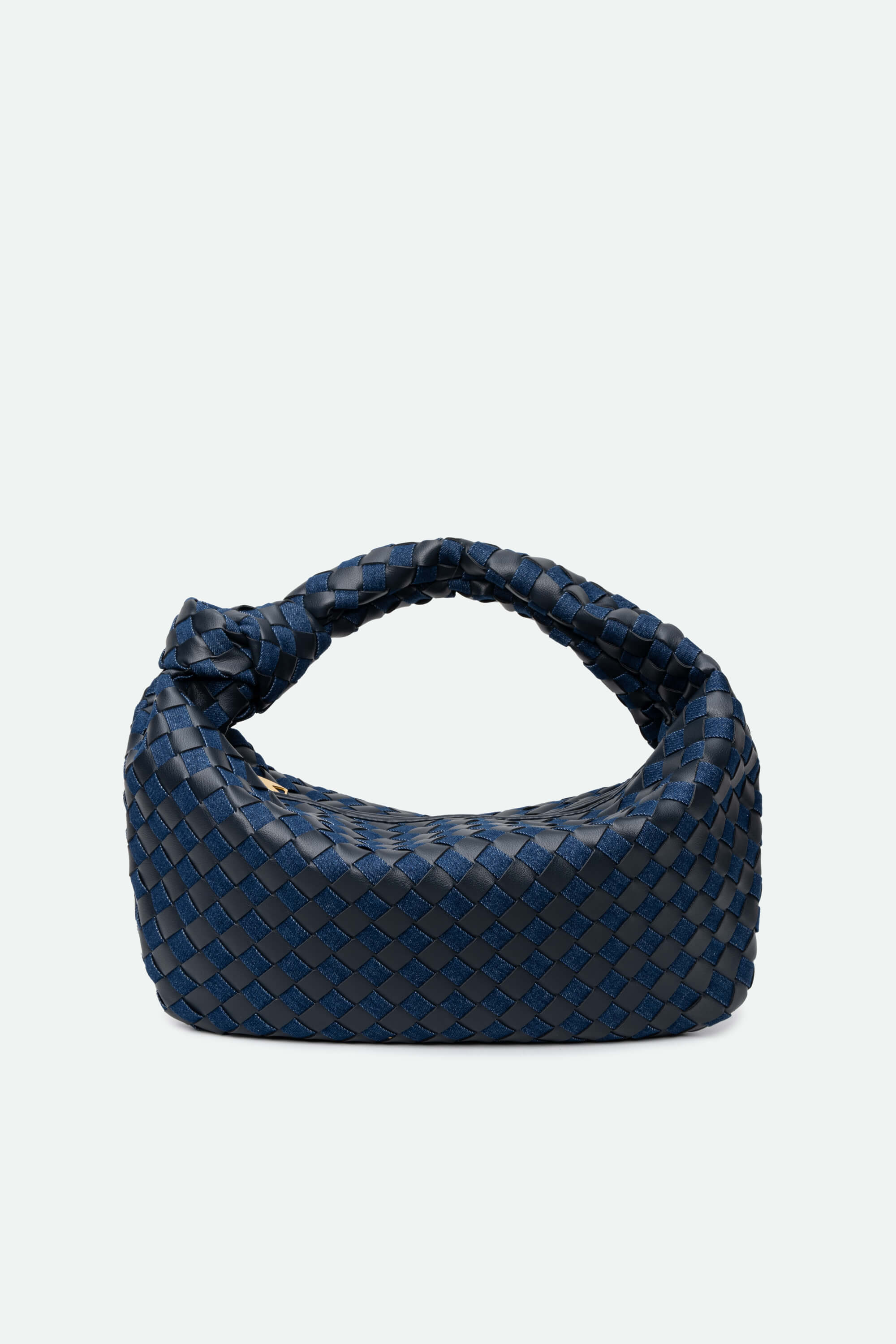 Blue woven handbag on a light gray background