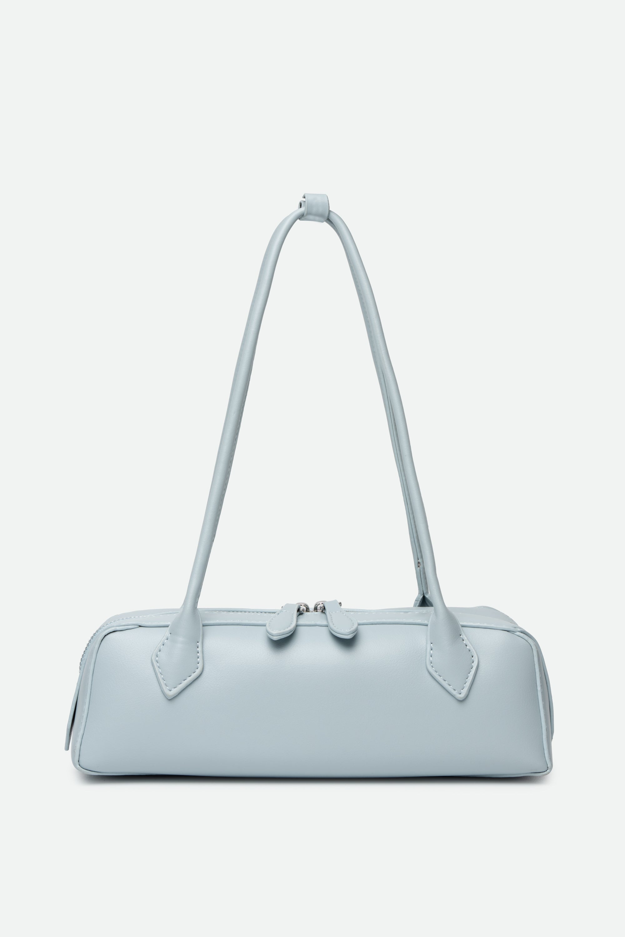 Light blue handbag with a strap on a white background
