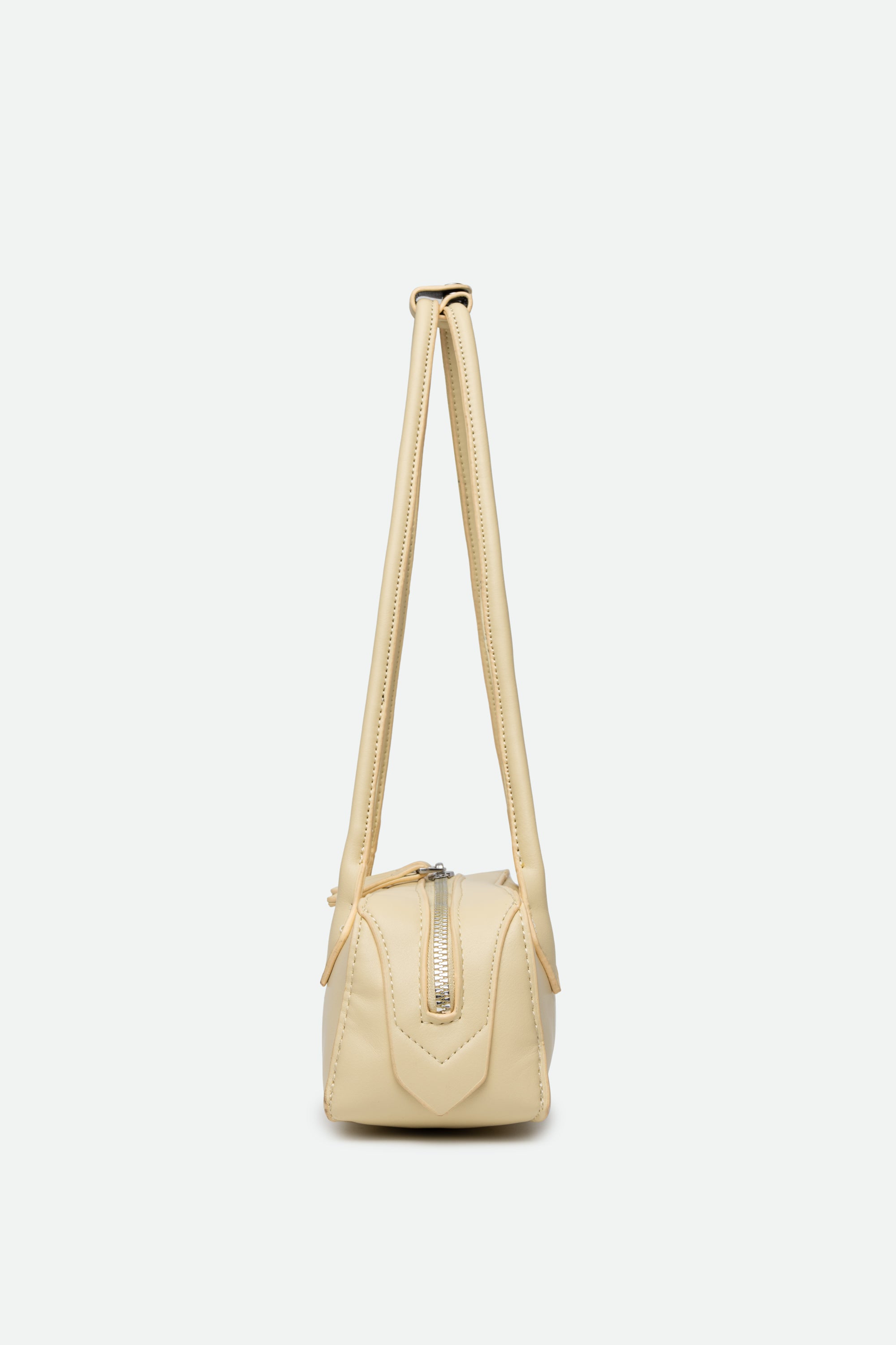 Beige handbag with a strap on a white background