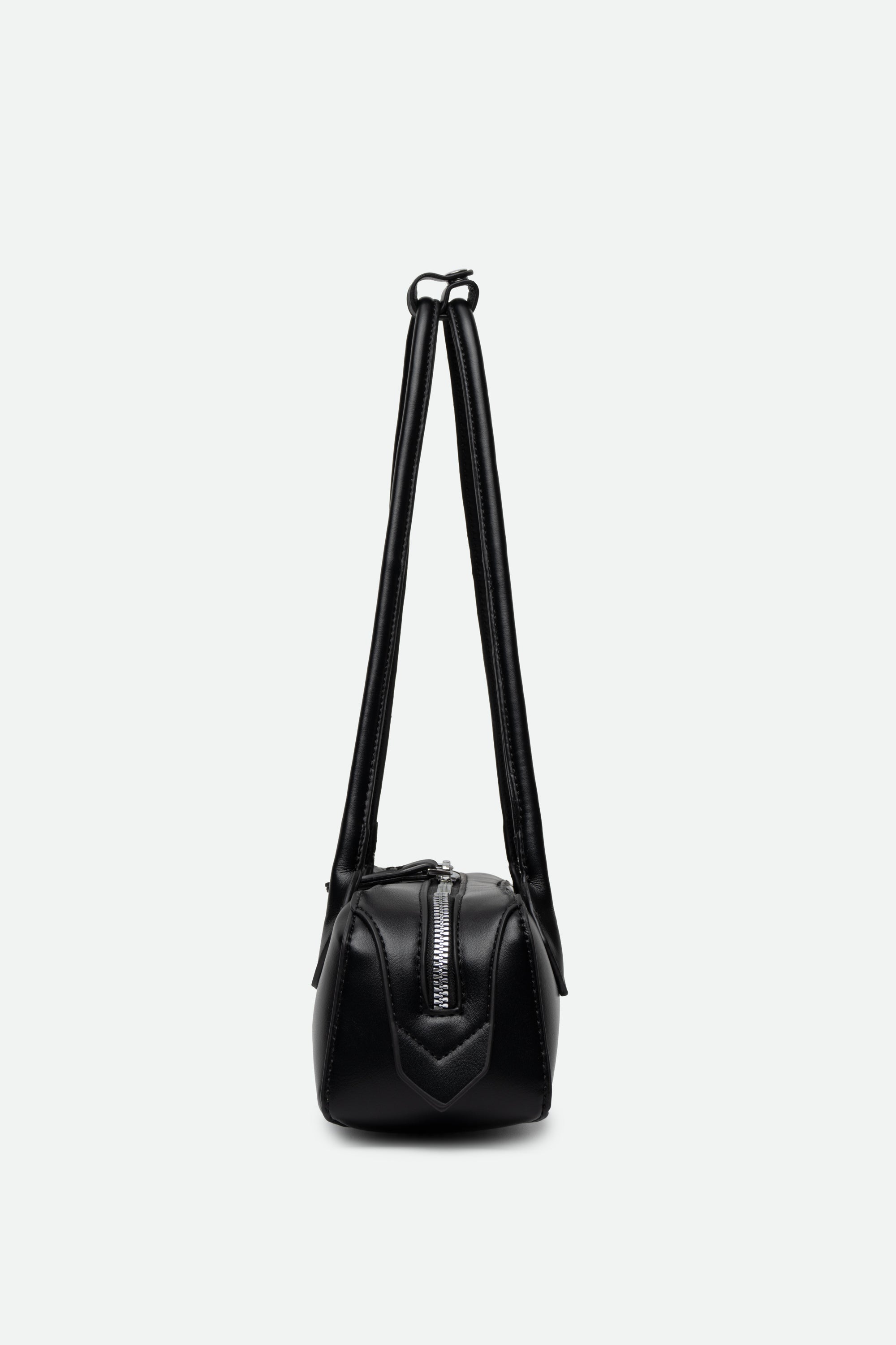 Black leather handbag with a strap on a white background