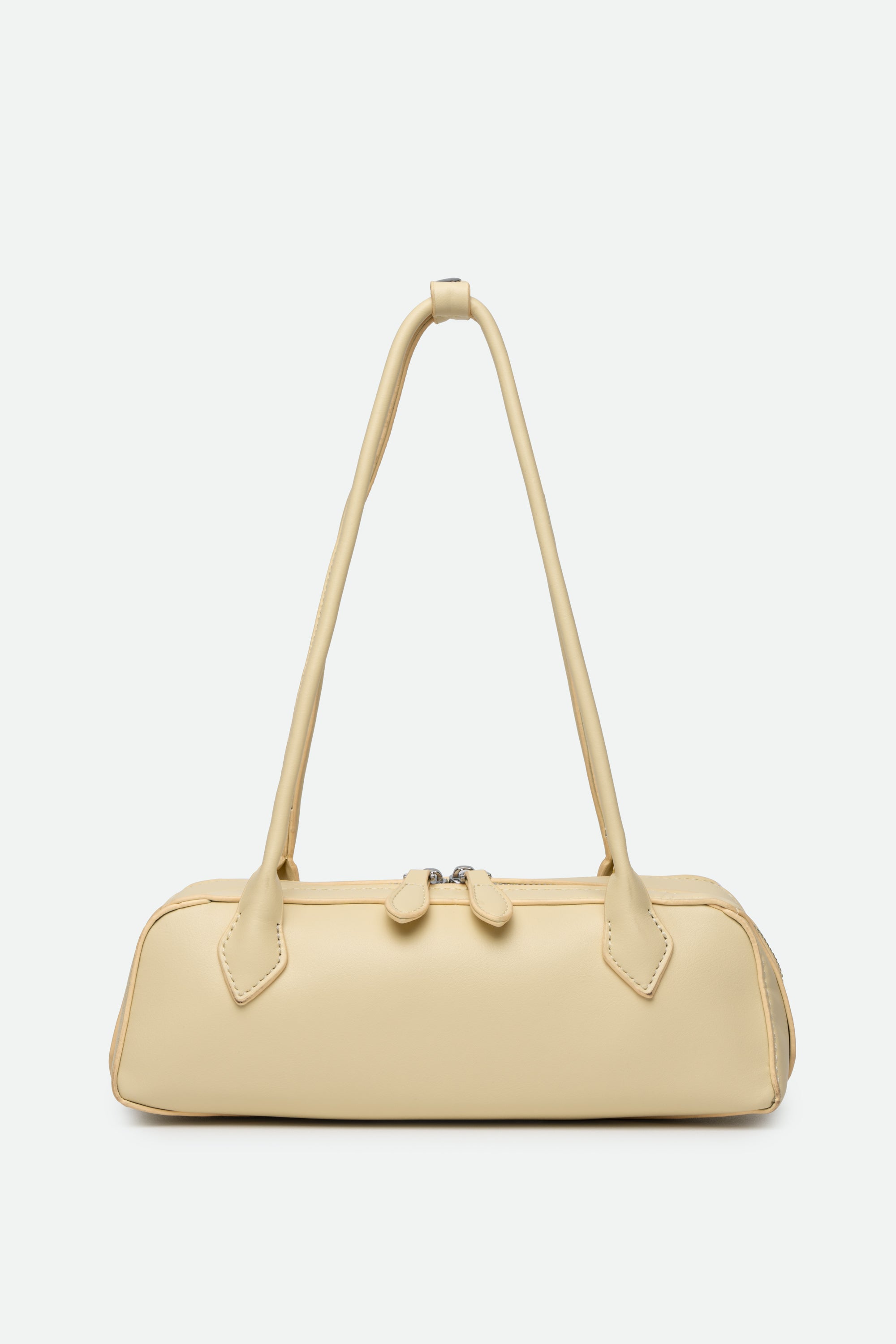 Beige handbag with a strap on a white background