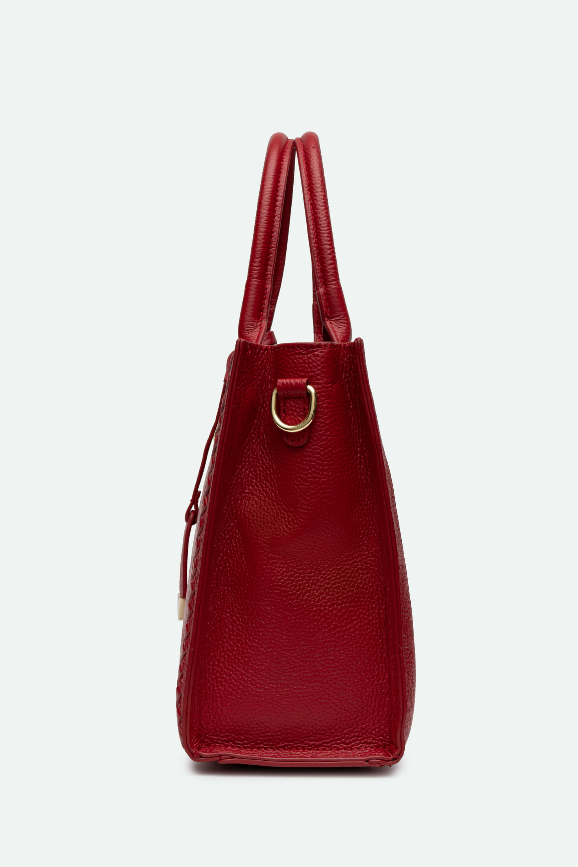Red handbag with a gold clasp on a white background