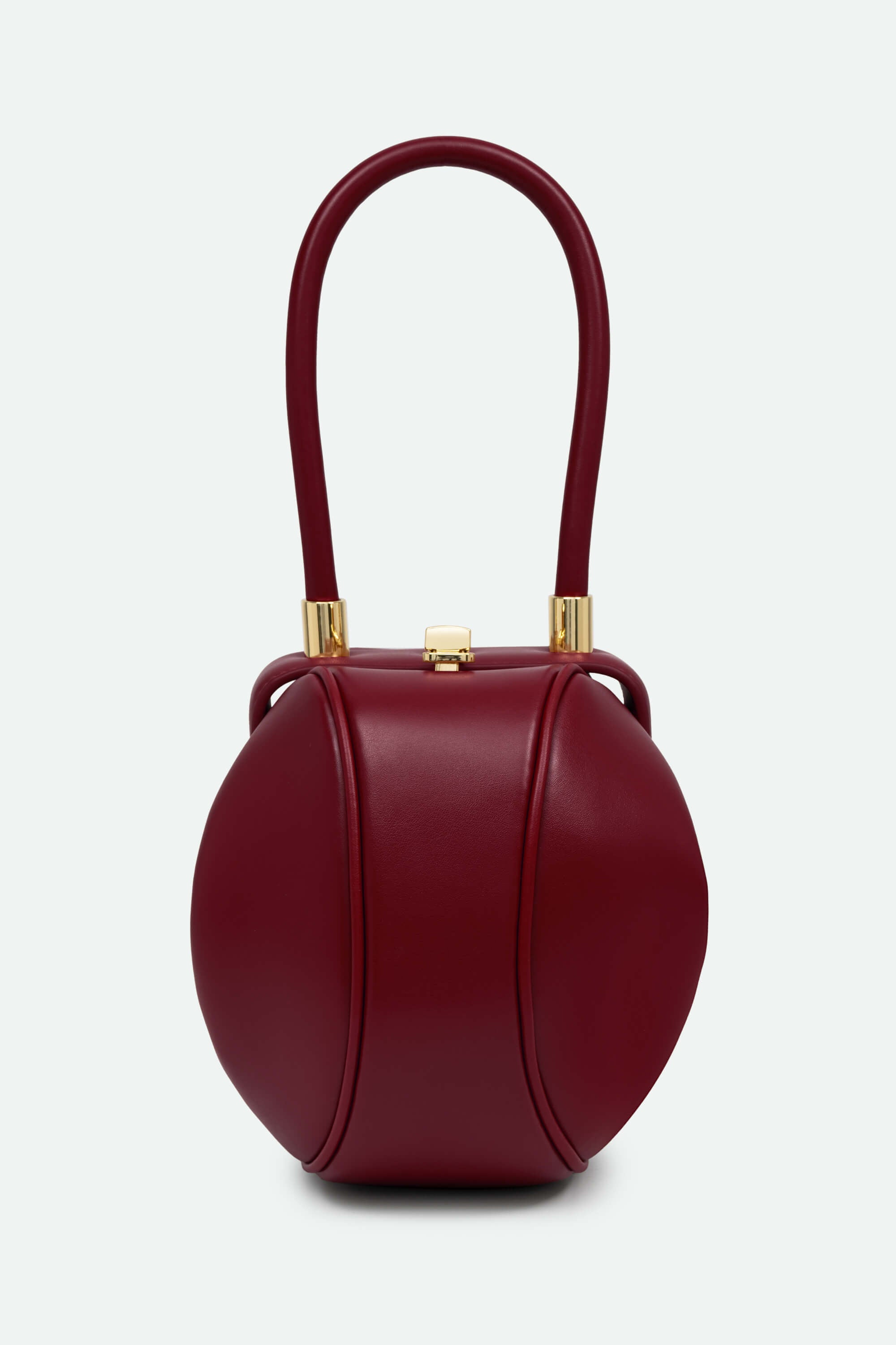 Red handbag with gold accents on a white background