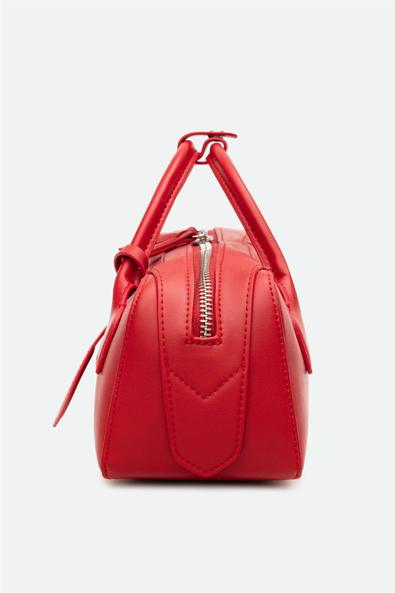 Red handbag with a handle on a white background