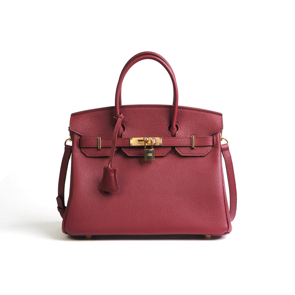 Red handbag with gold hardware on a white background