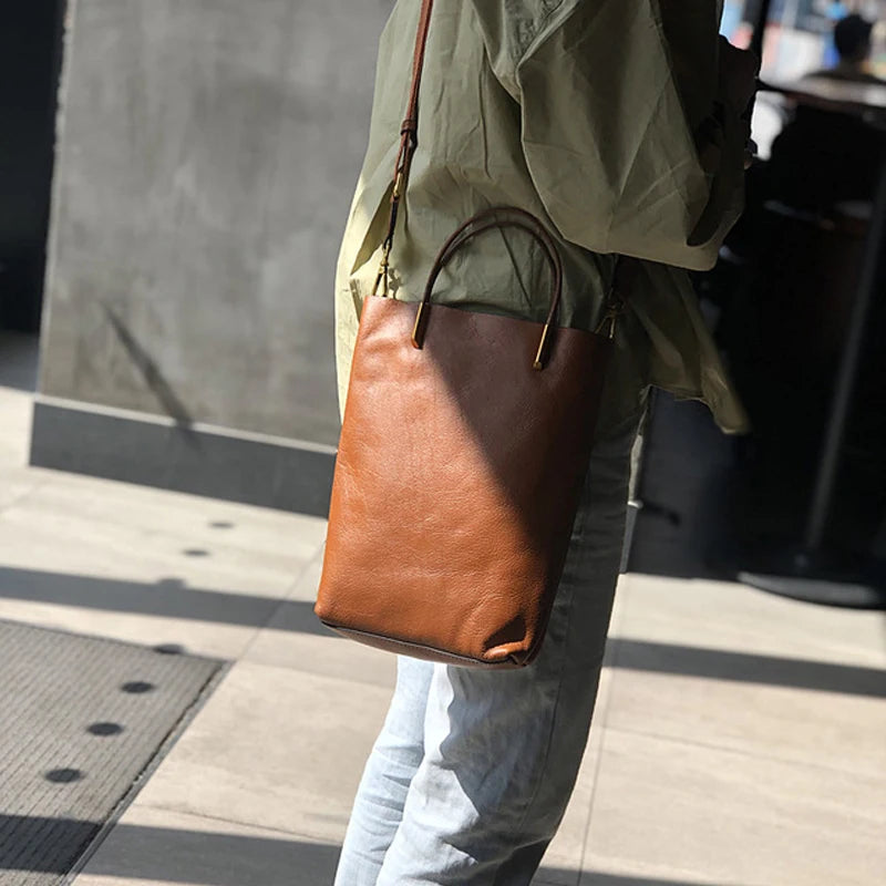 Valentina Verona top-handle bag in Coffee, worn