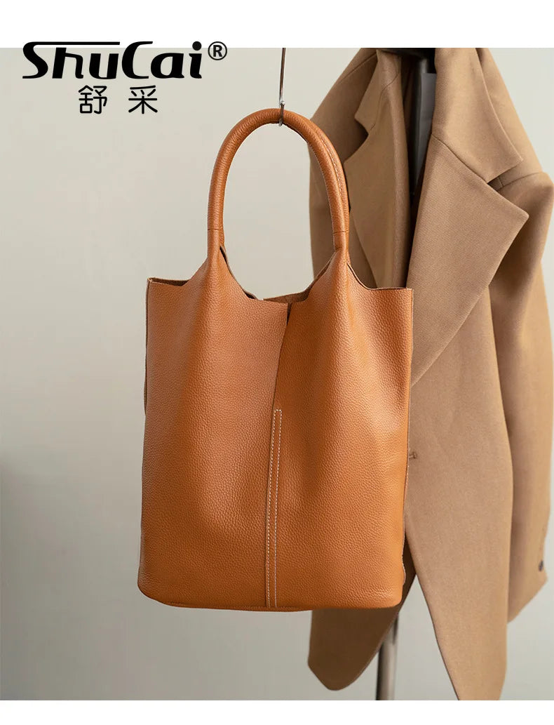 Valentina Arco bucket bag in Burgundy, worn