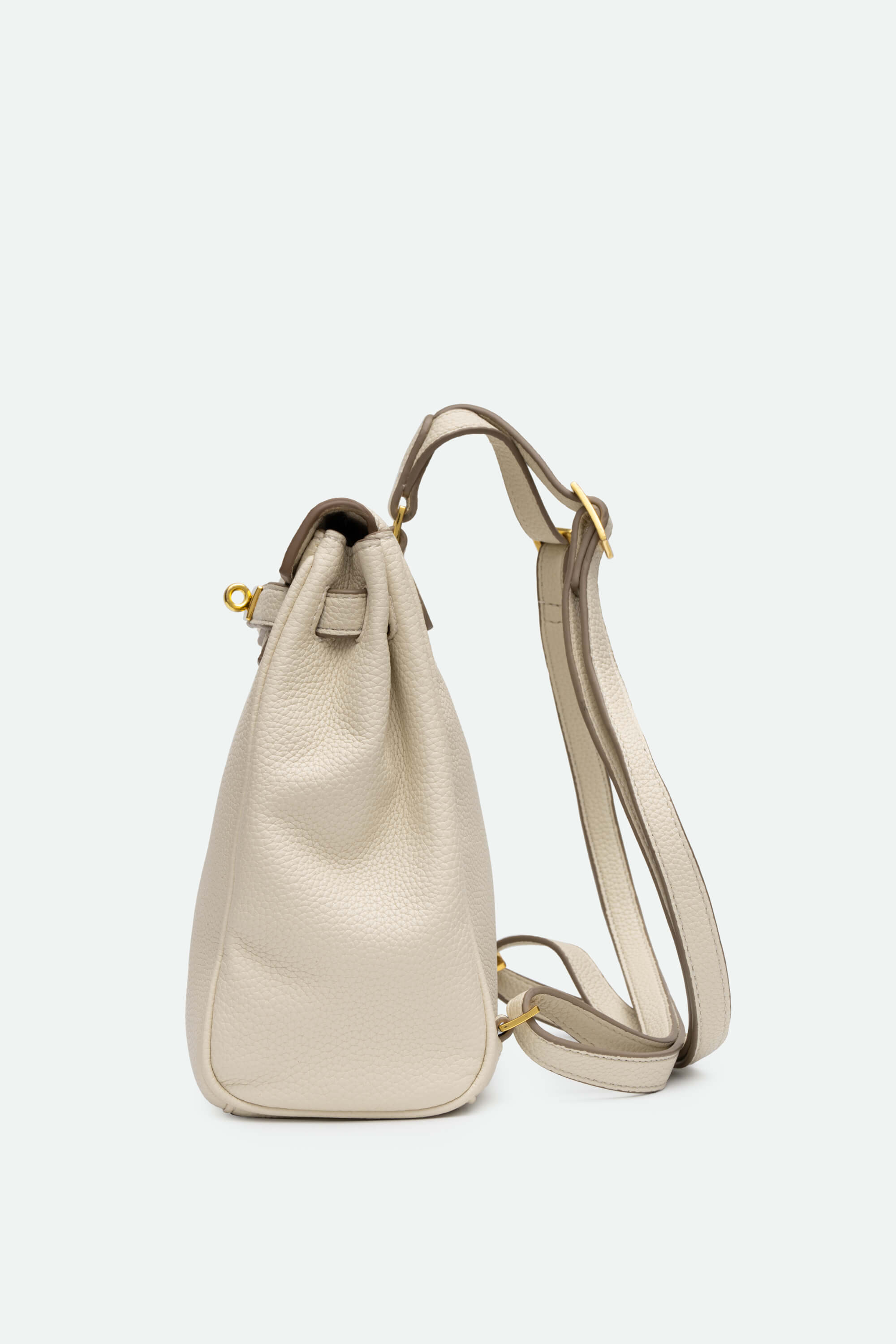 Beige leather backpack with a drawstring top on a light gray background