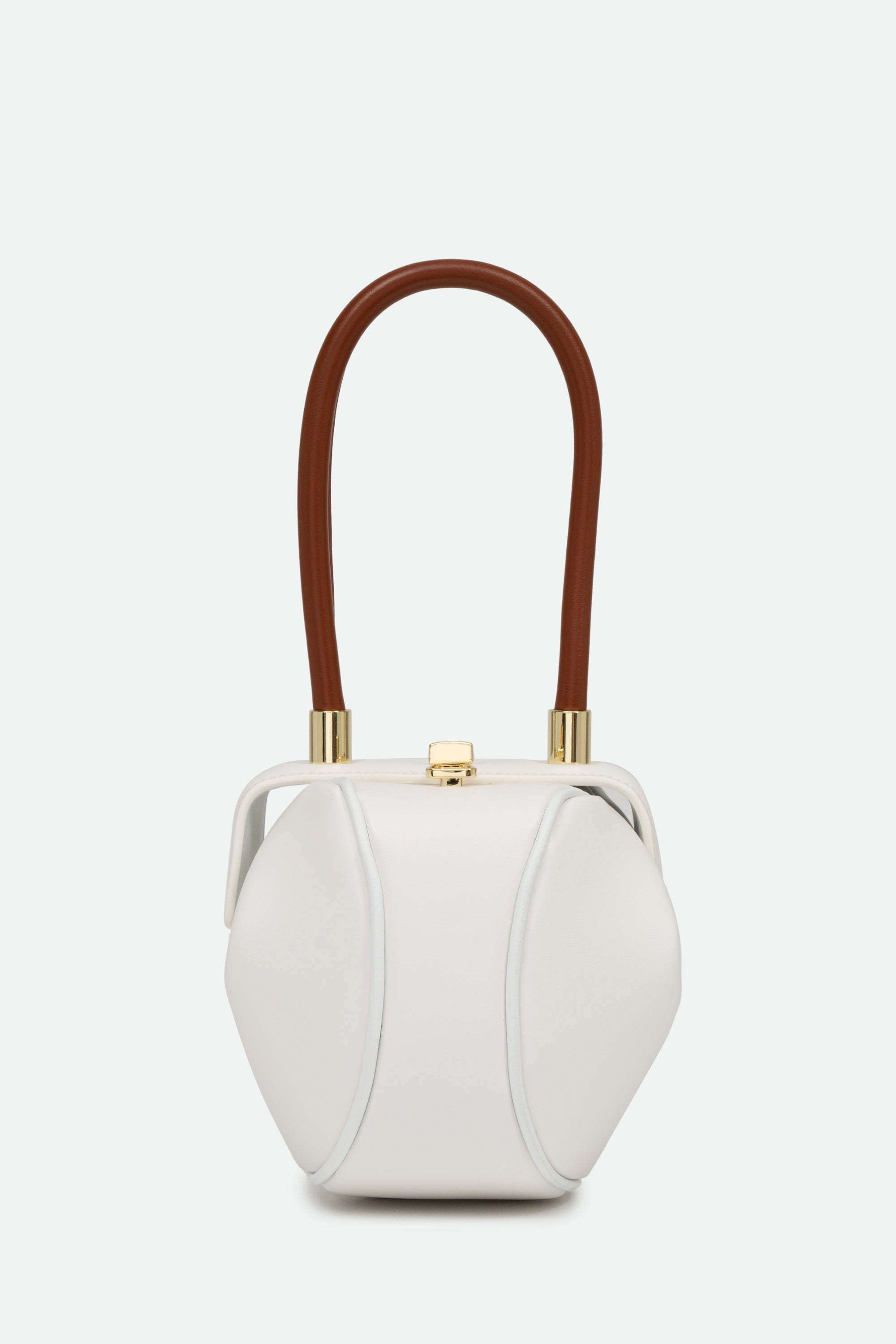 White handbag with brown handle on a white background