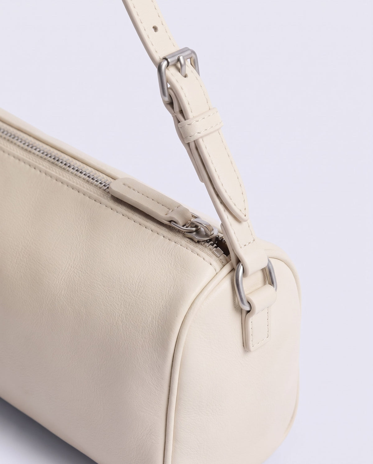 Alba barrel shoulder bag in Ivory leather – silver buckle and zip hardware detail