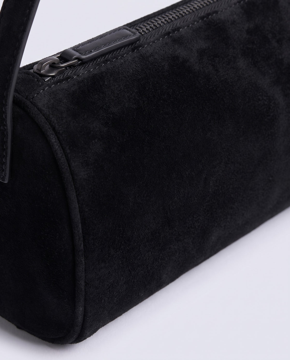 Alba barrel shoulder bag in Onyx black suede – close-up of the suede texture