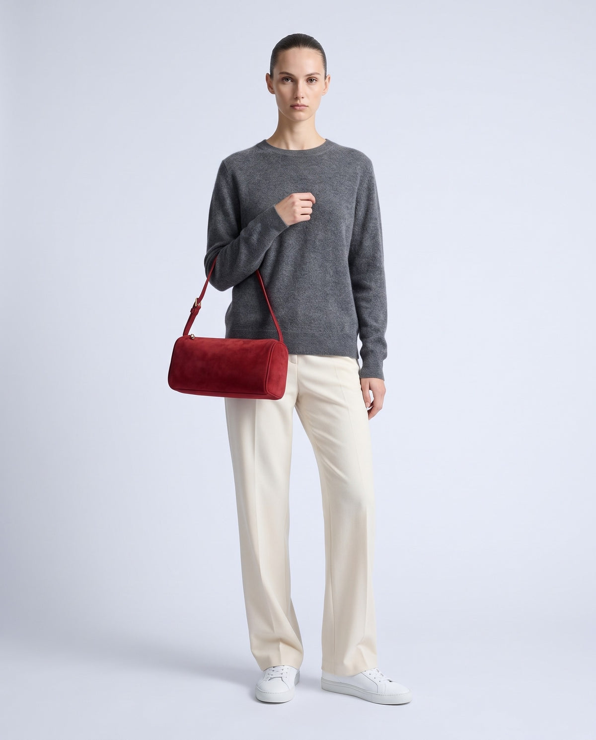 Model wearing the Alba barrel shoulder bag in Red suede – full length