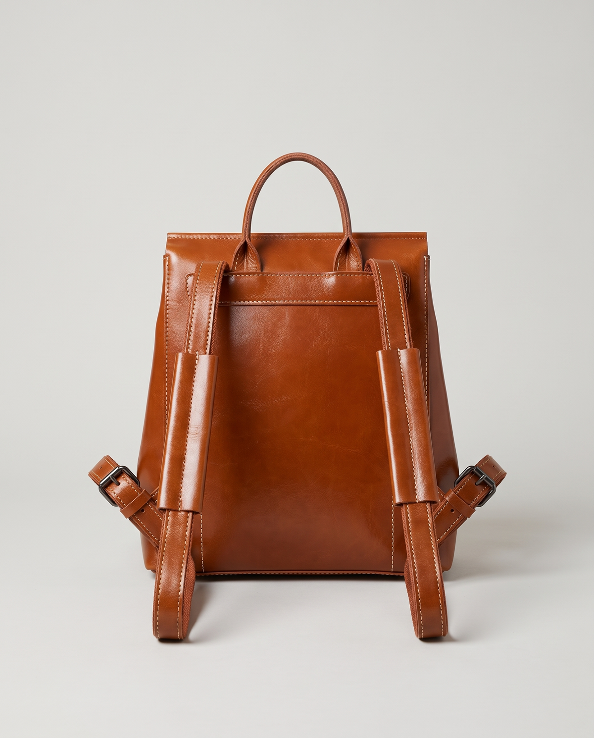 Ambler waxed leather backpack in Brown – back view showing the shoulder straps