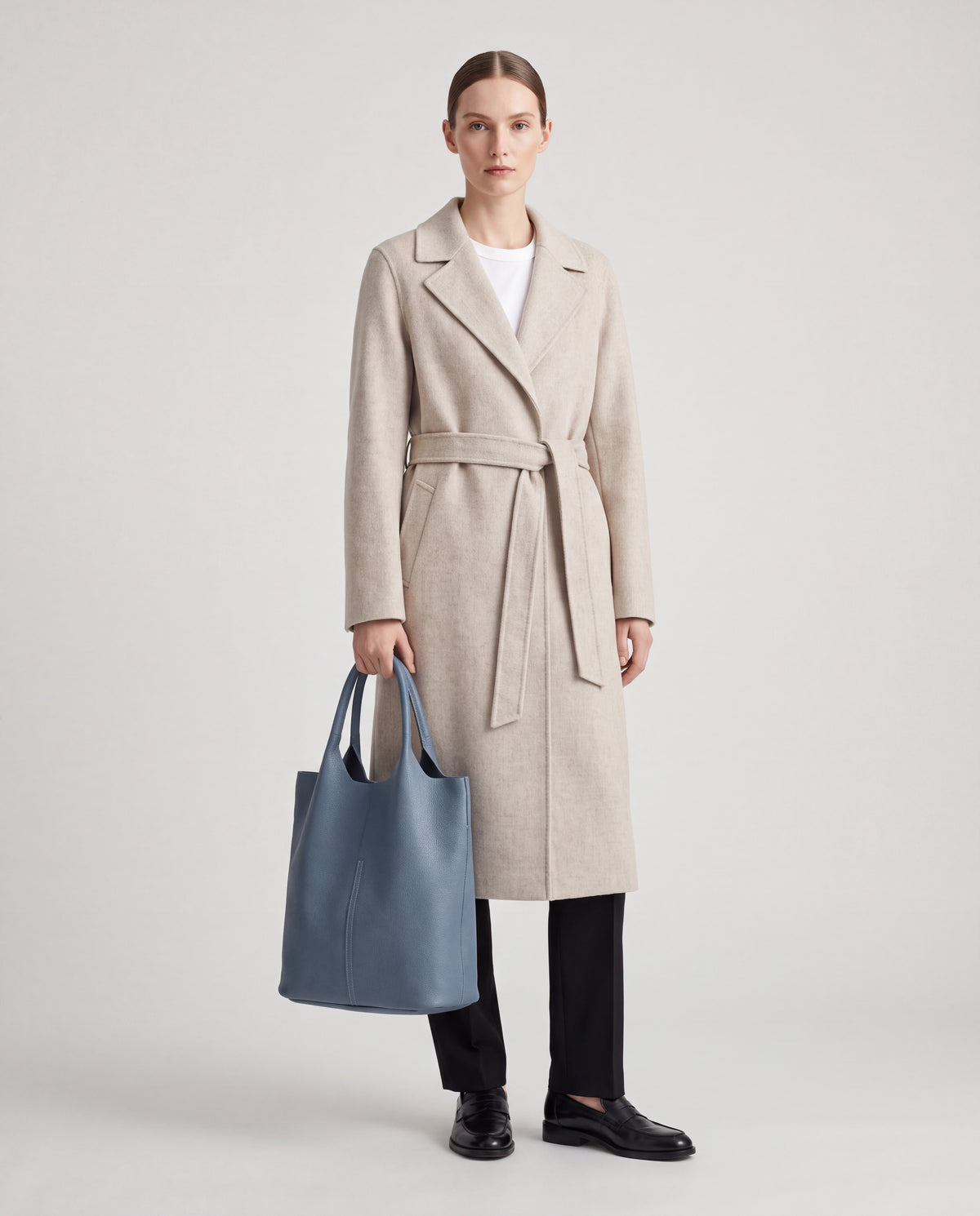 Arco bag in Blue – worn by model, full length