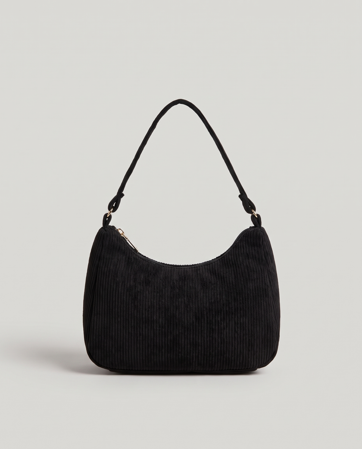 Aura corduroy shoulder bag in Black – front view