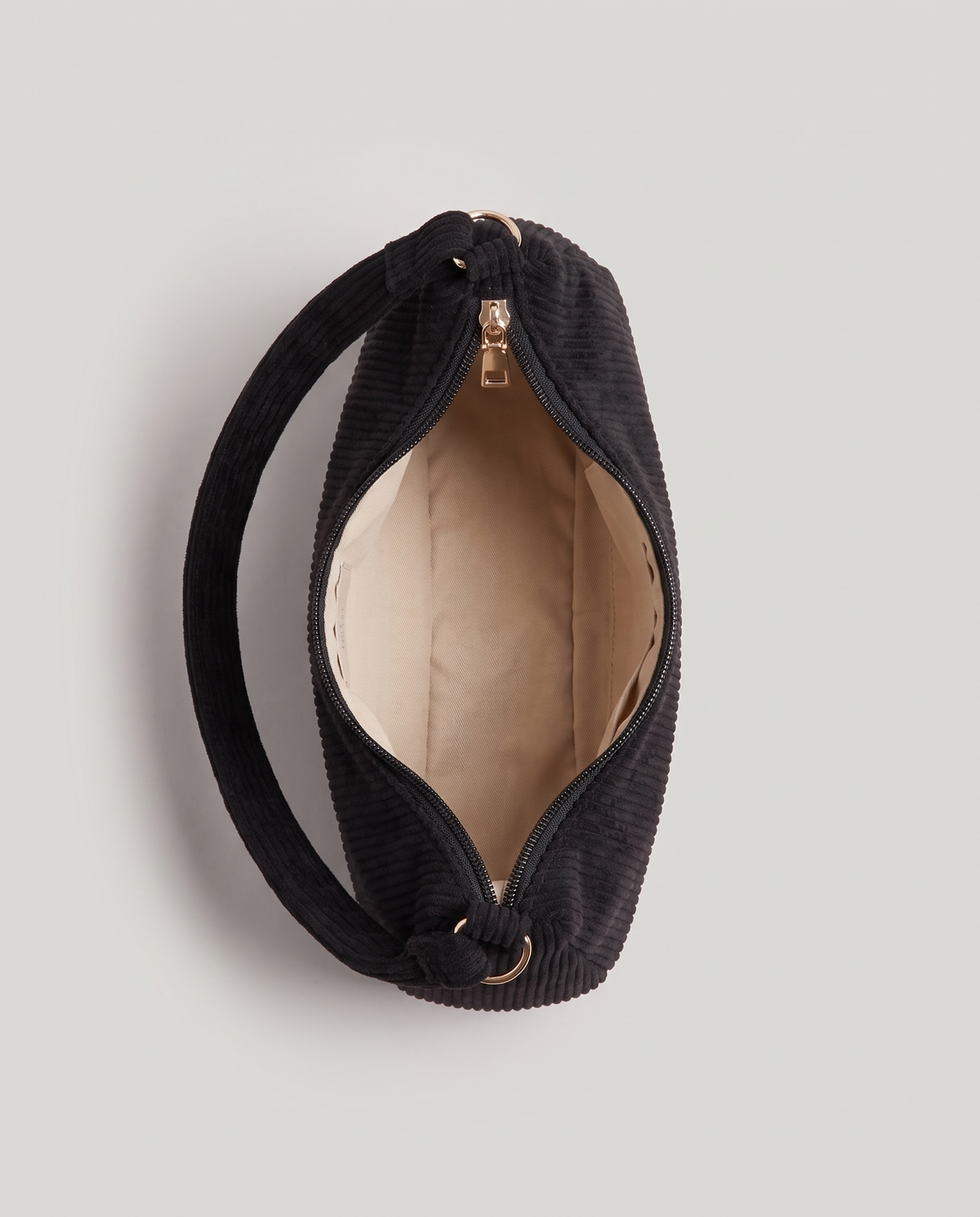 Aura corduroy shoulder bag in Black – view from above with the zip open