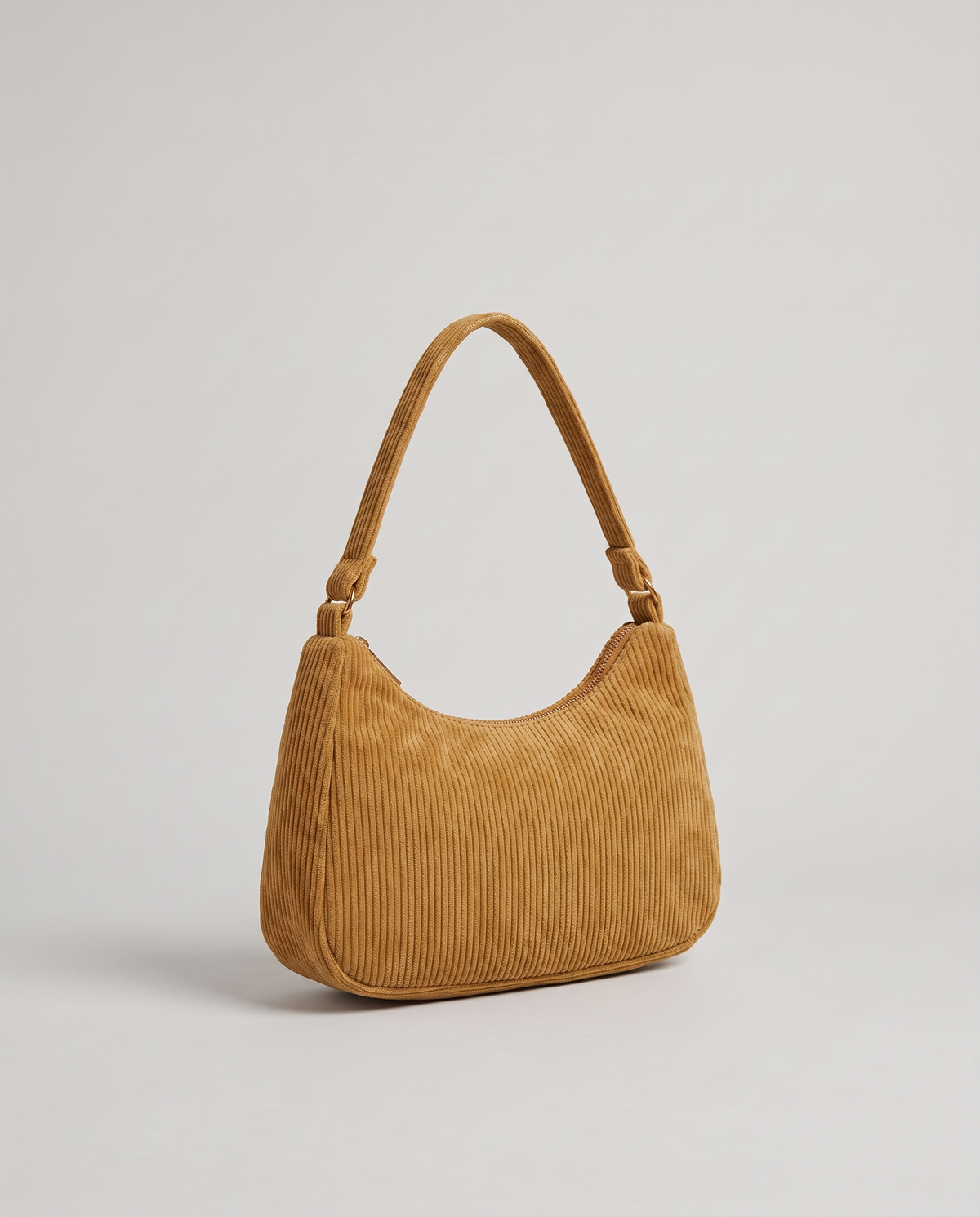 Aura corduroy shoulder bag in Tan – three-quarter view
