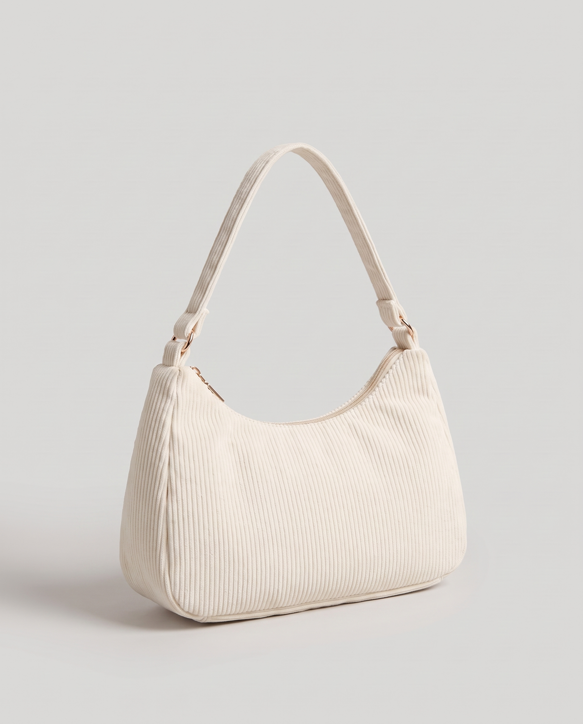 Aura corduroy shoulder bag in White – three-quarter view