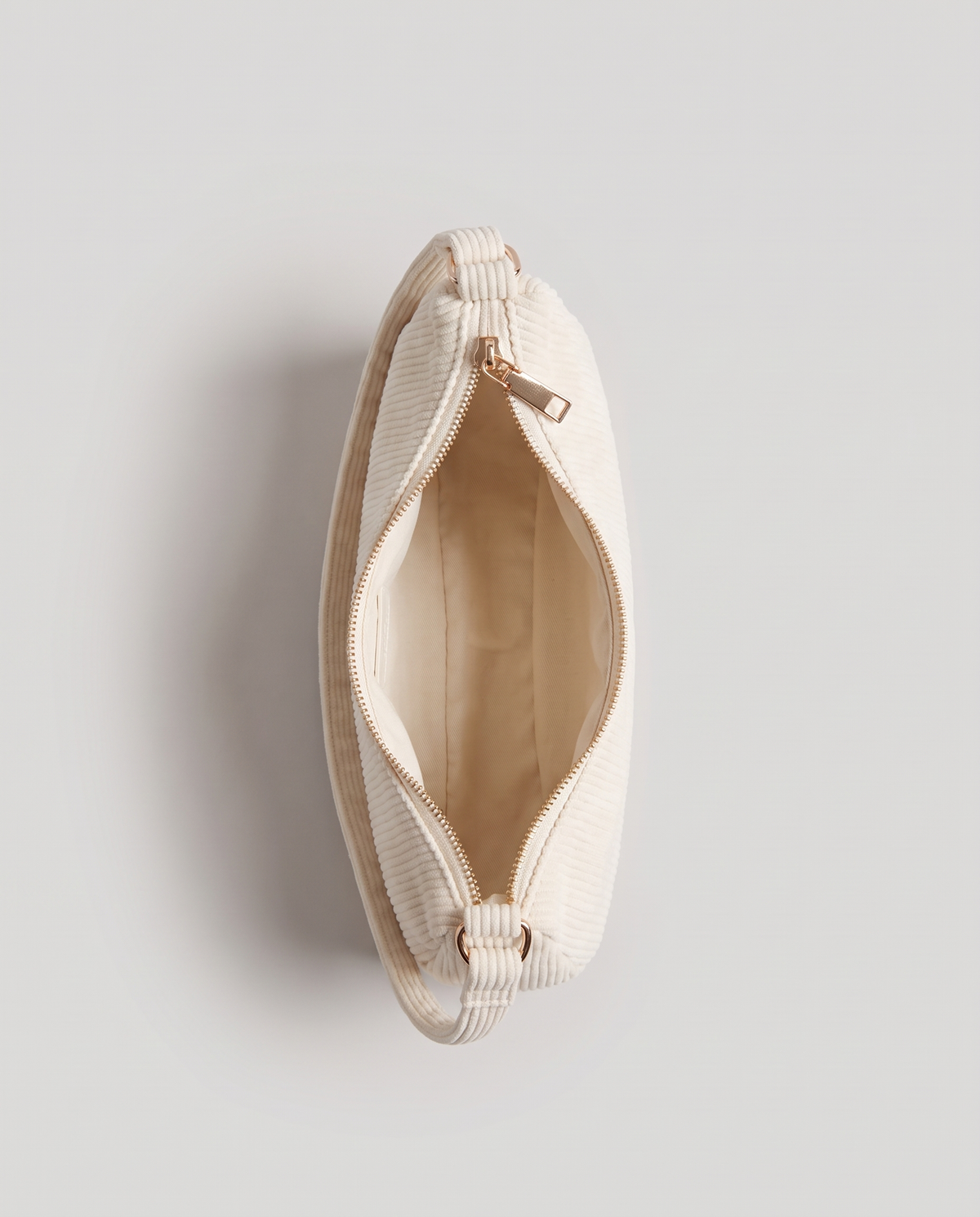 Aura corduroy shoulder bag in White – view from above with the zip open