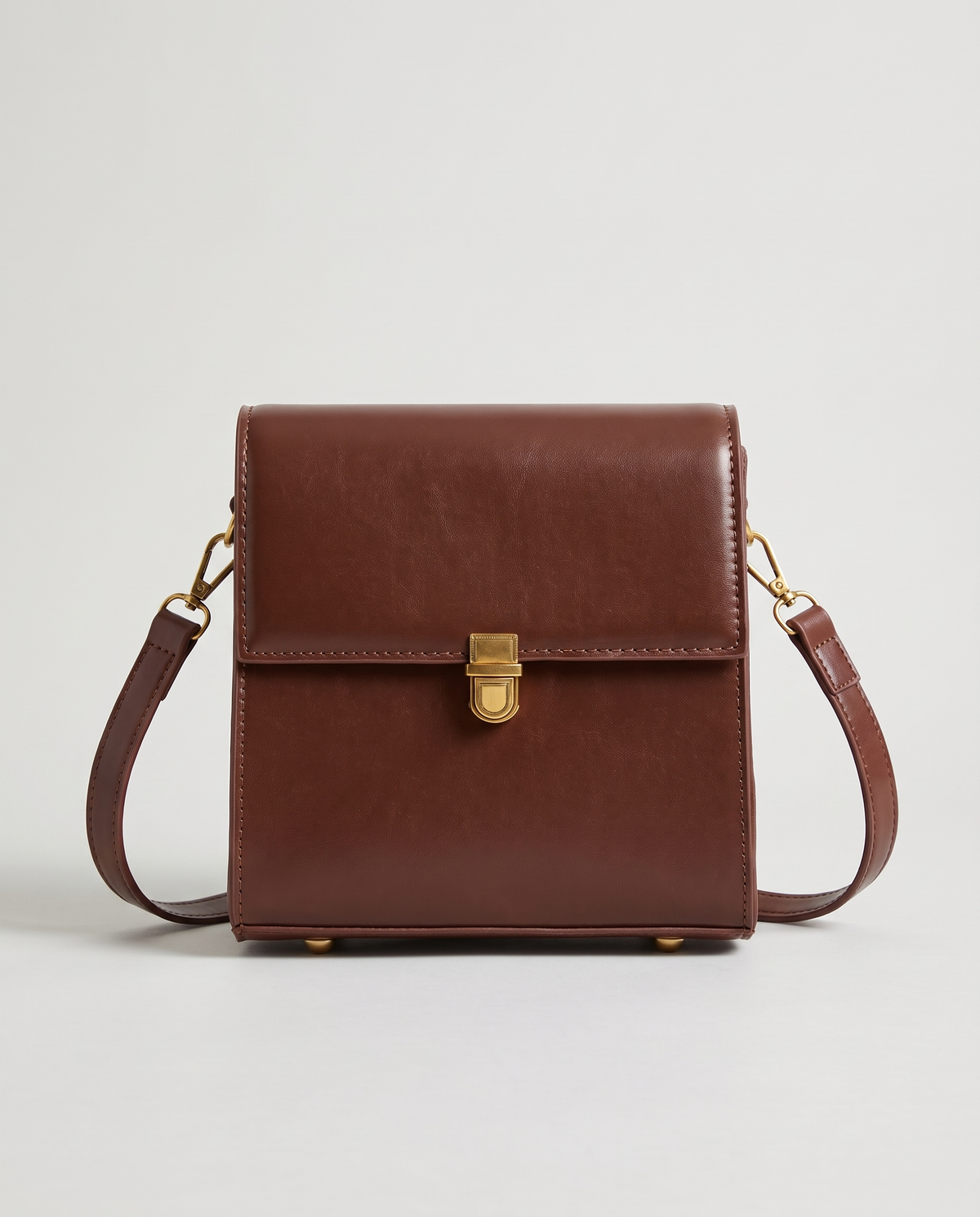 Bloc square vegan leather crossbody bag in Brown – front view