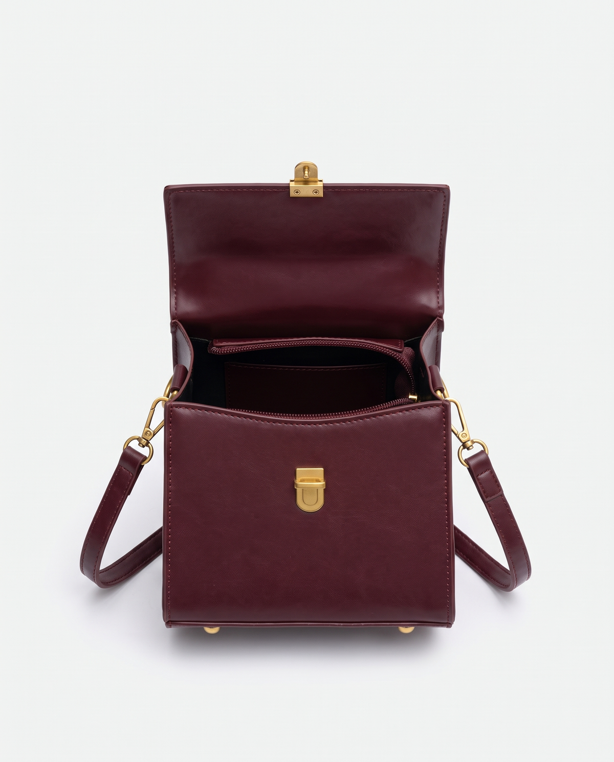 Bloc square vegan leather crossbody bag in Cherry – open, showing the interior
