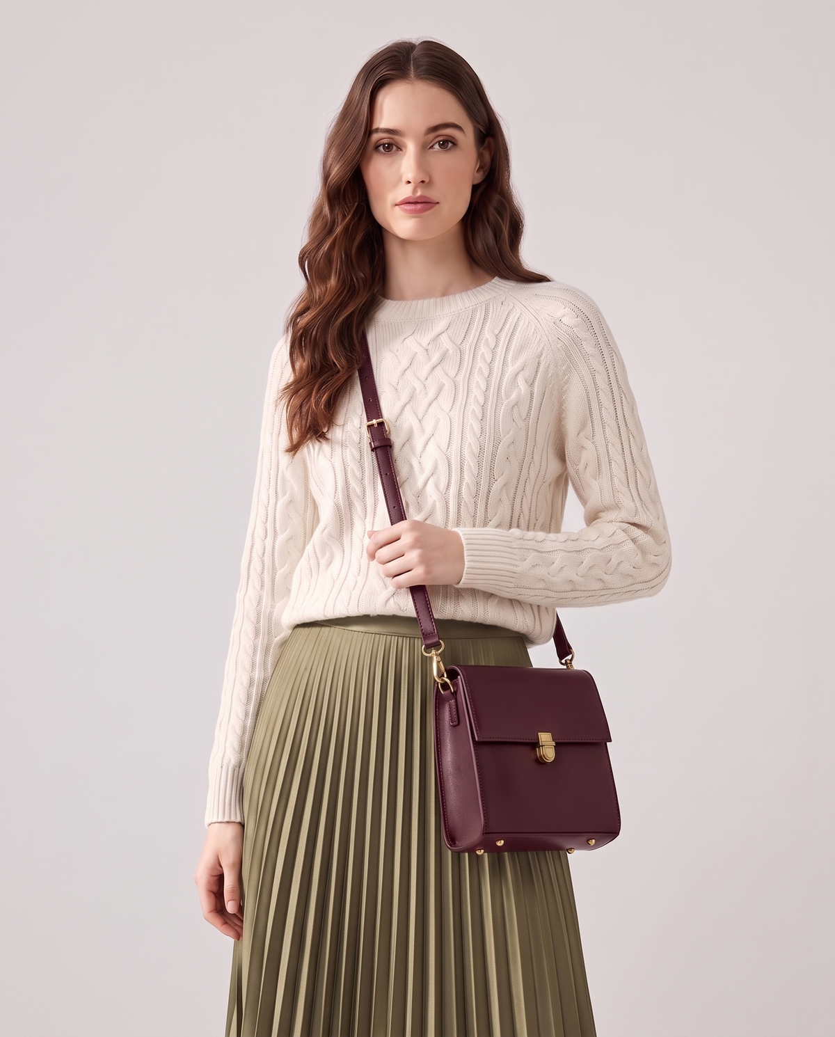 Bloc square vegan leather crossbody bag in Cherry – model wearing it crossbody, waist-up