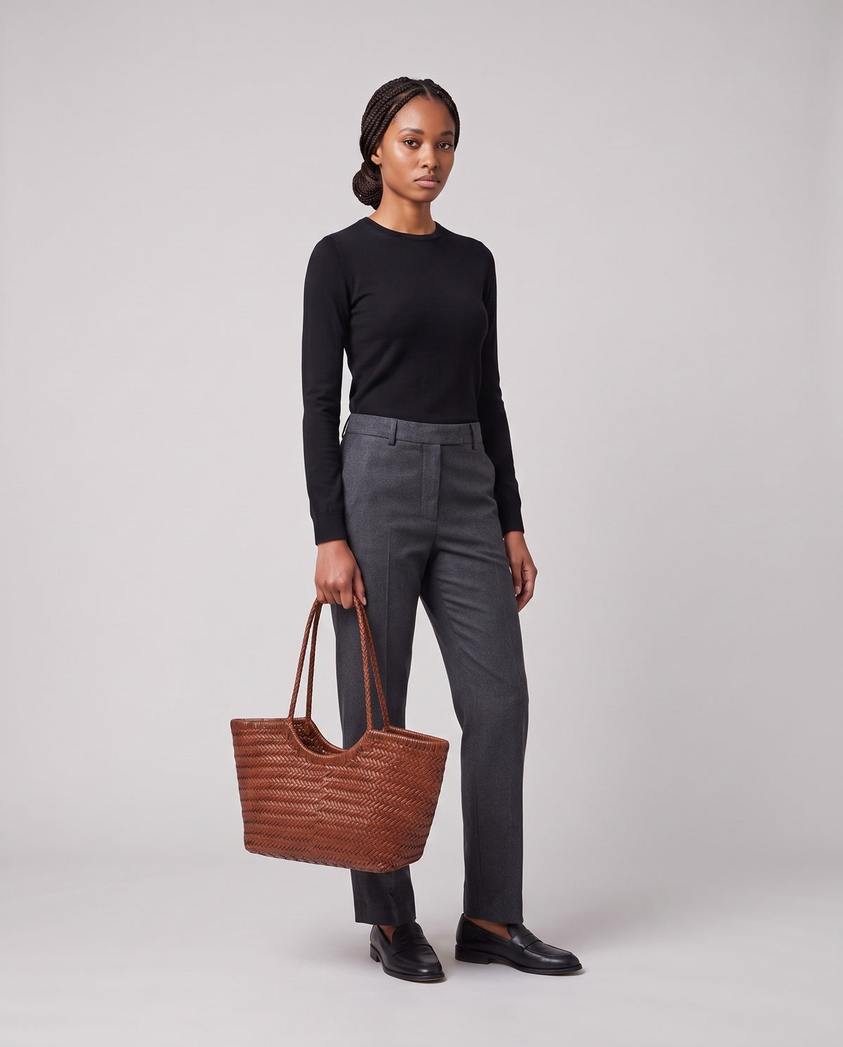 Model holding the Valentina Bosa bag in Cognac, full length