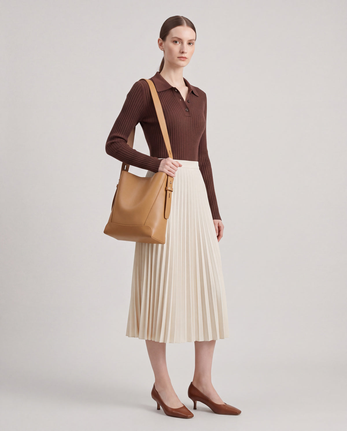 Calce bag in Camel – worn by model, full length