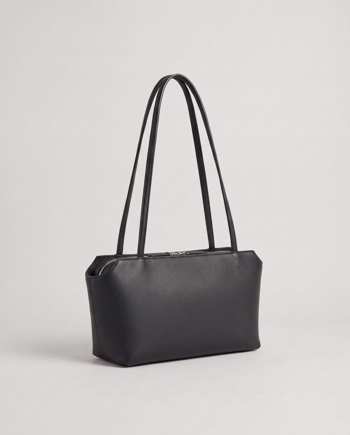 Capri leather shoulder bag in black, three-quarter view