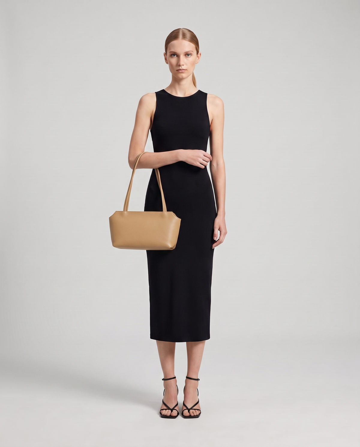 Model with the Capri leather shoulder bag in tan, full length
