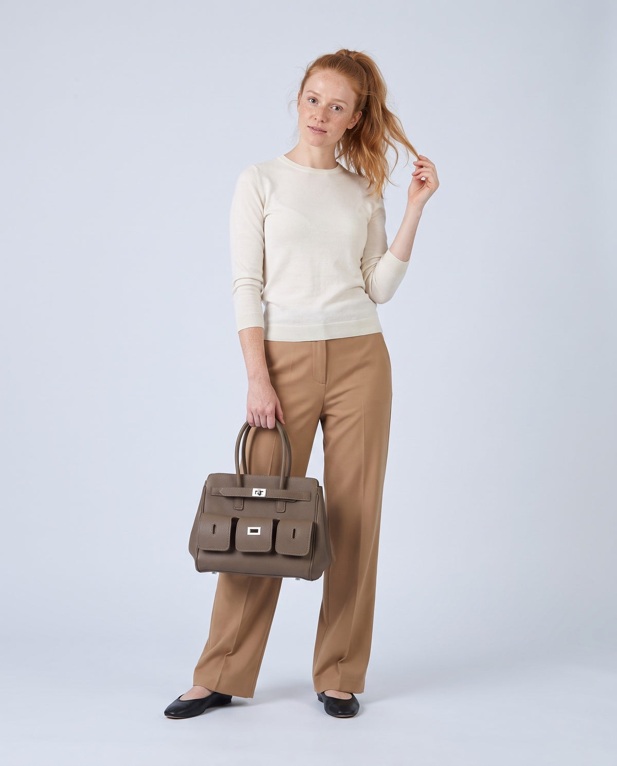 Model carrying the Capua leather tote in Mocha – full length