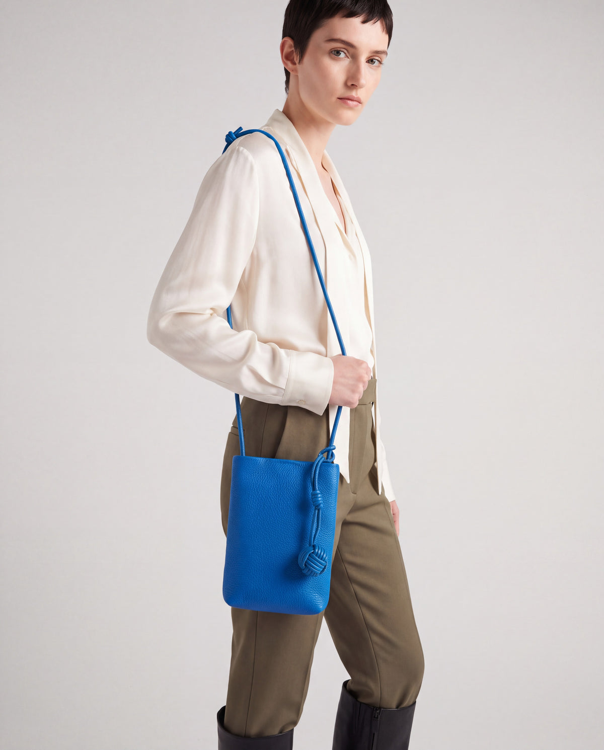 Cara bag in Cobalt – worn by model, close-up