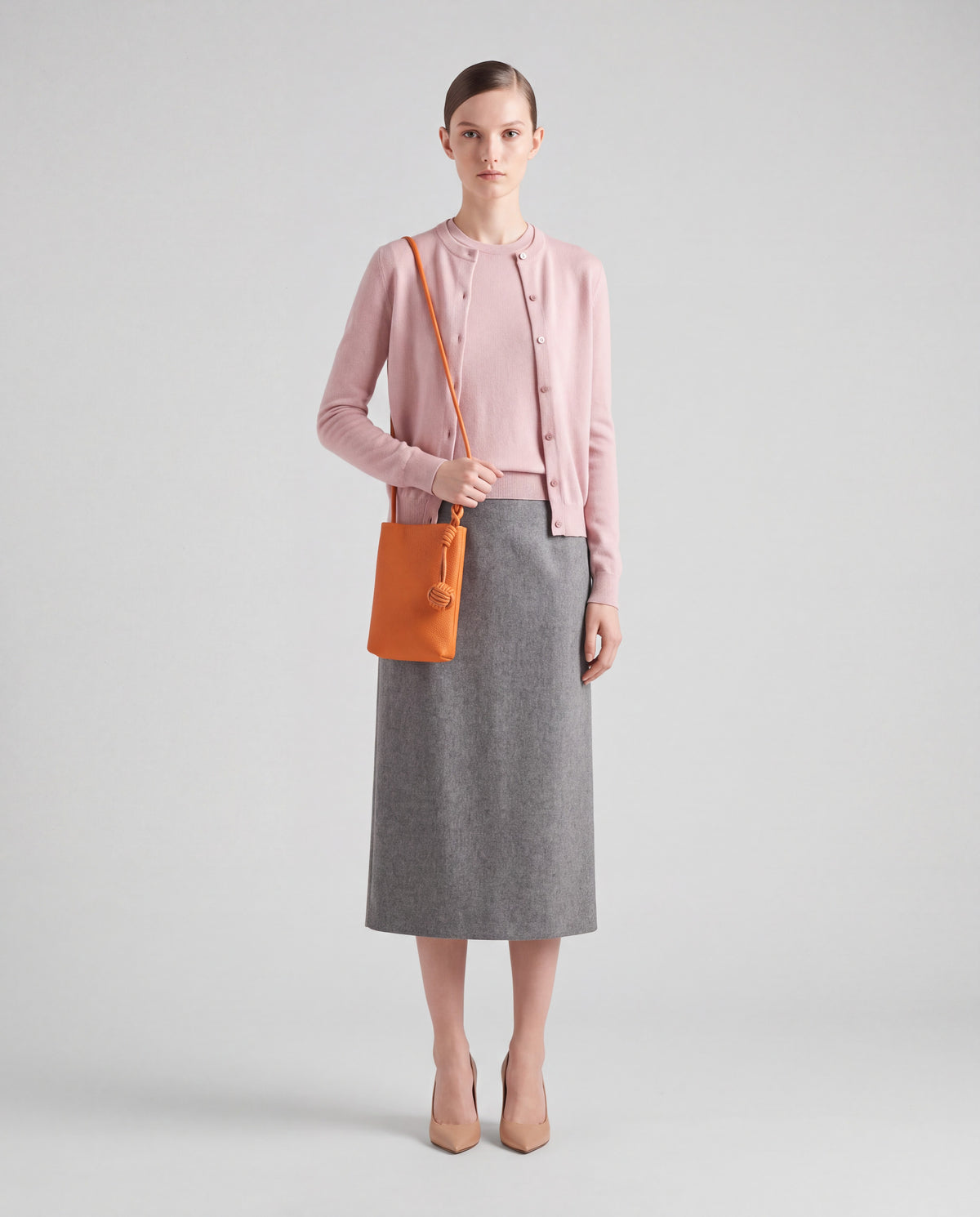 Cara bag in Orange – worn by model, full length