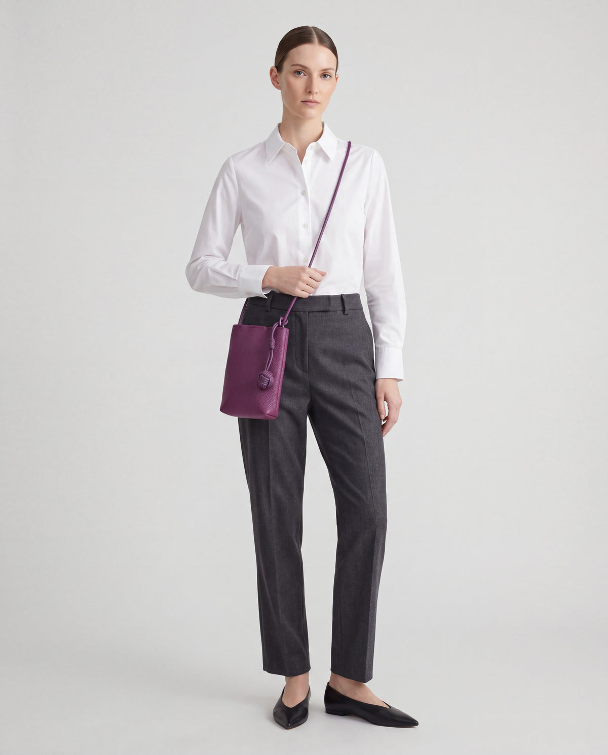 Cara bag in Plum – worn by model, full length