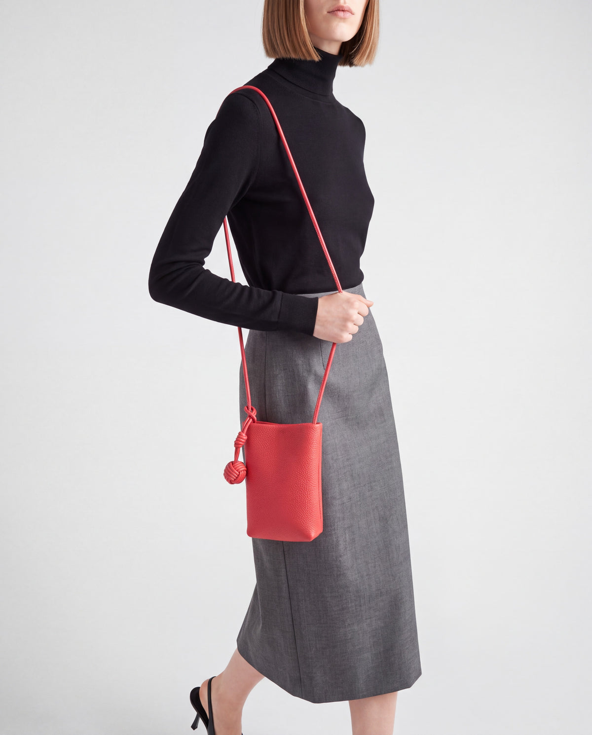 Cara bag in Red – worn by model, close-up