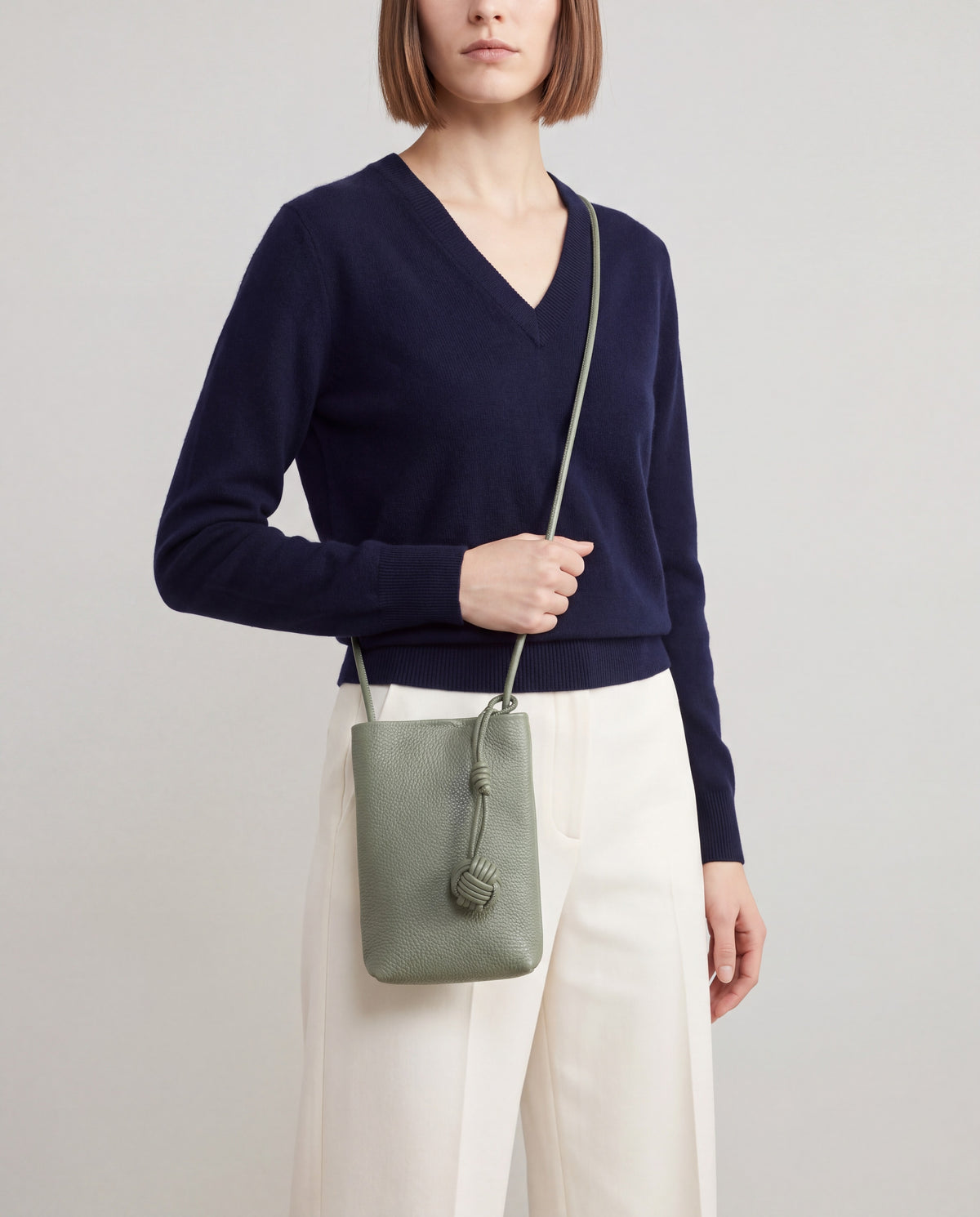 Cara bag in Sage – worn by model, close-up
