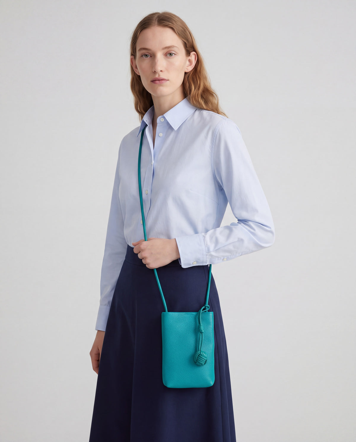 Cara bag in Teal – worn by model, close-up