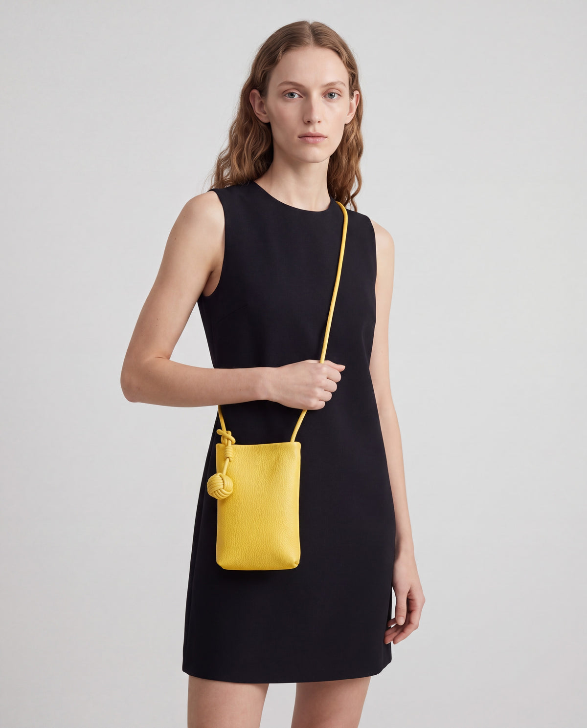 Cara bag in Yellow – worn by model, close-up