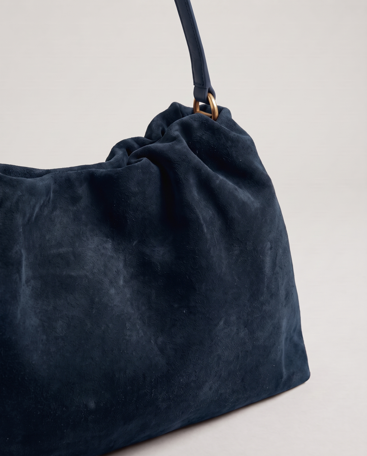 Cielo gathered suede bag in navy, hardware and leather detail