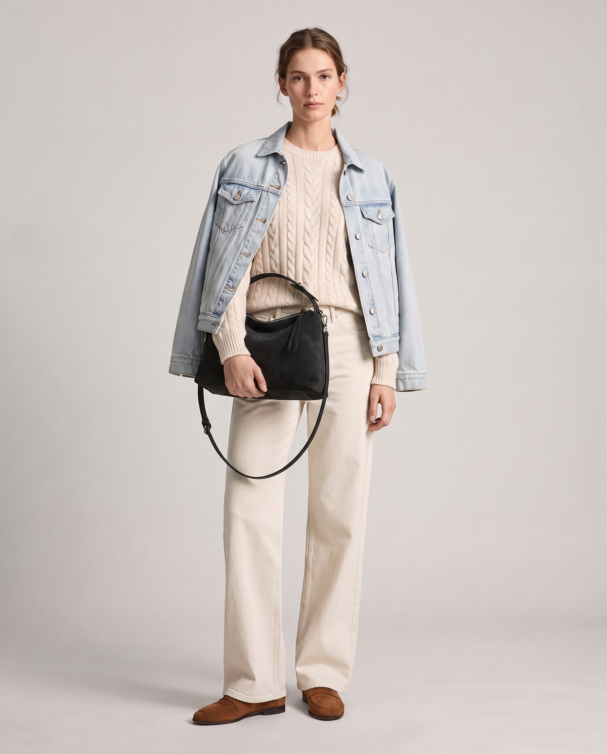 Model with the Cima suede shoulder bag in black, full length