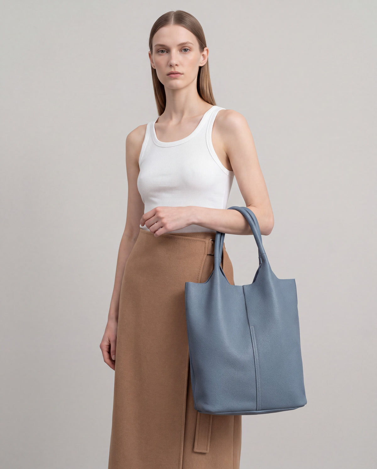 Commute bag in Blue – worn by model, close-up