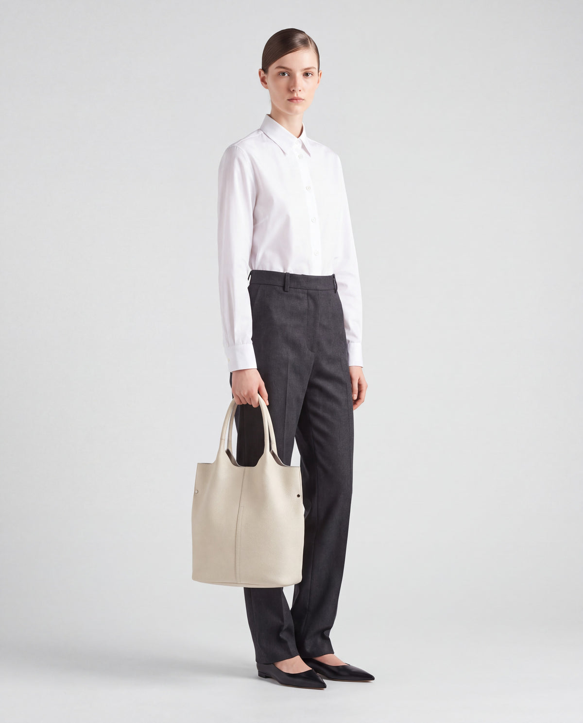 Commute bag in Cream – worn by model, full length