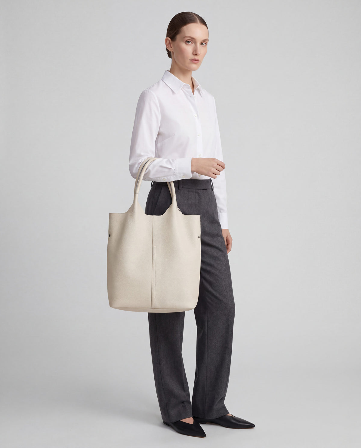 Commute bag in Cream – worn by model, close-up